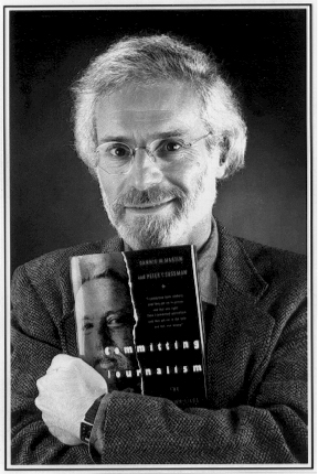 Peter Y. Sussman with his book, Committing Journalism